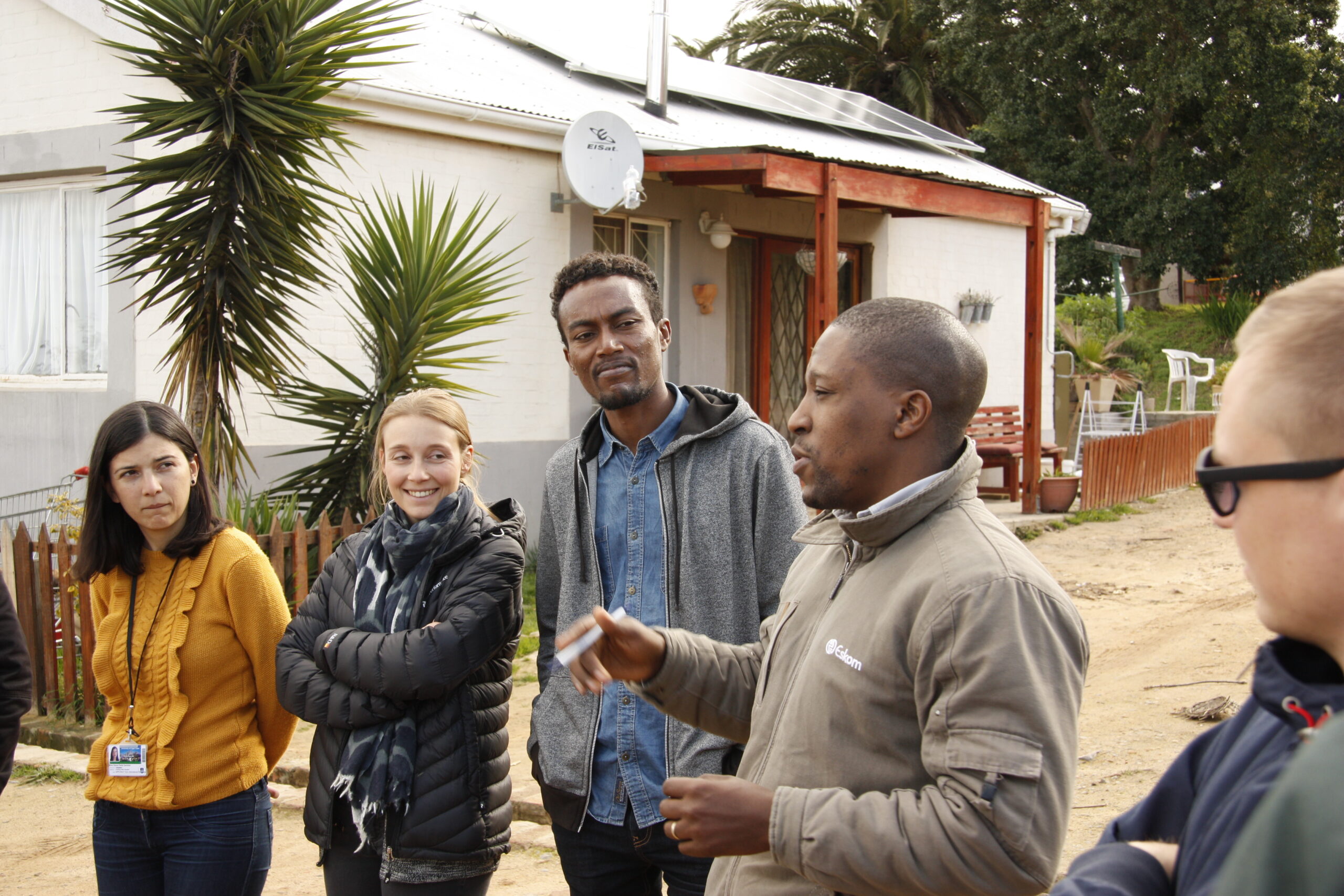 Excursion to the Lynedoch Eco Village outside of Stellenbosch. In the picture a empolyee from Eskom, the South African electricity public utility, explains about microgrids. Photo credit: Energy Politics Group and ETH Global.