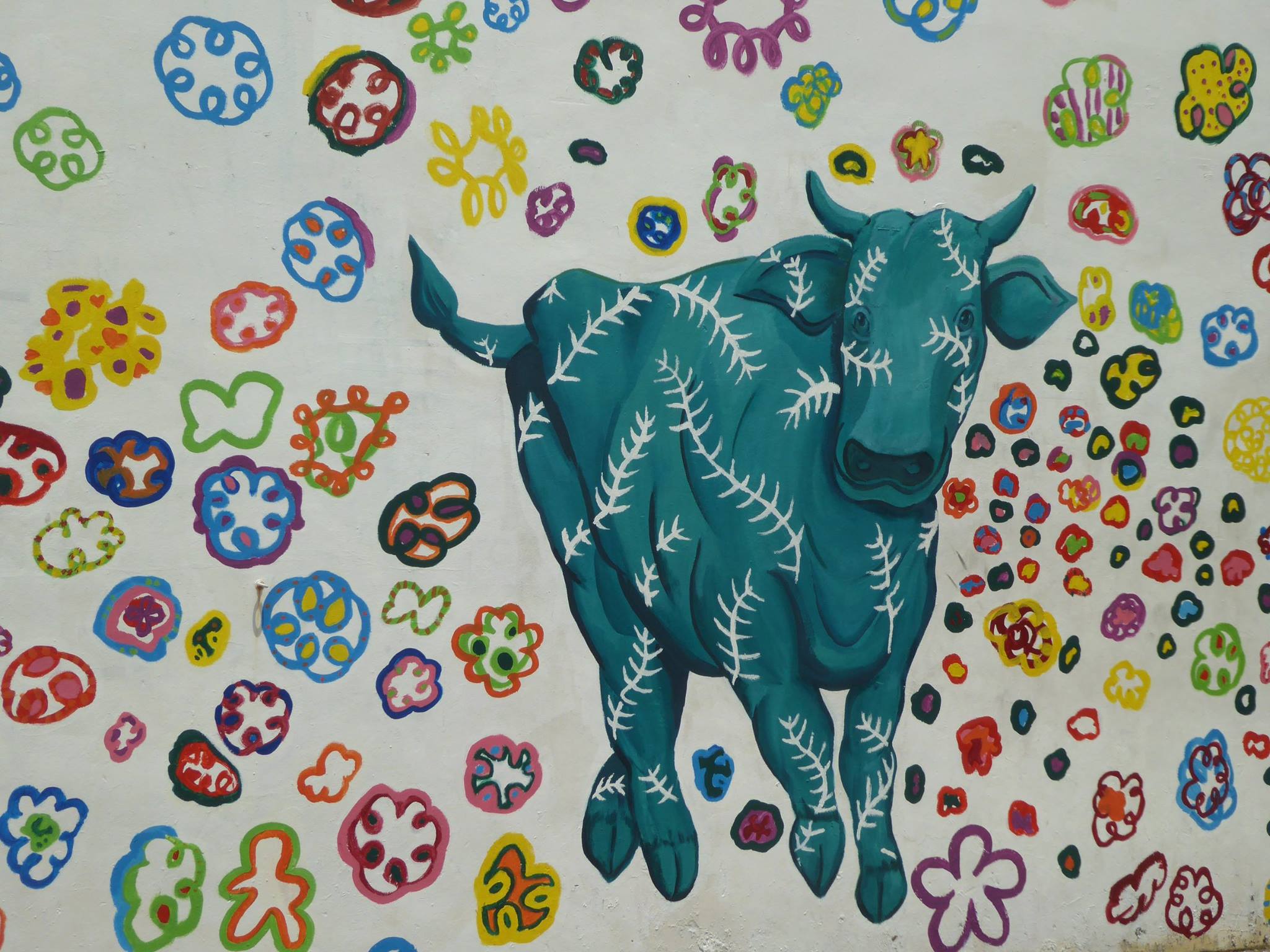 Picture of a green cow with flowers