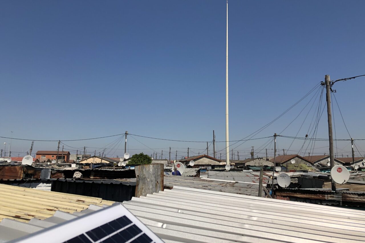 Electric Mast above roofs made of corrugated iron