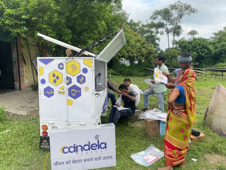 People standing around the solar cart